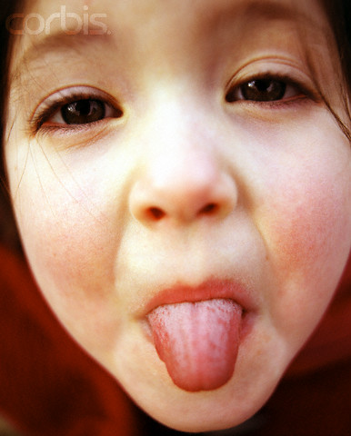 sticking tongue out - rude, tongue is in a central position, and greatly extended
